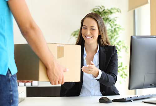 Happy girl receiving a courier